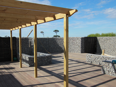 Landscaping transforms the outside living area in this custom house renovation