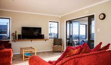 Living room view with mounted TV | Builders in New Plymouth