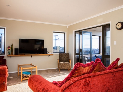 Living room view with mounted TV | Builders in New Plymouth