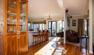 A view of the dining room and into the living | Home builders New Plymouth