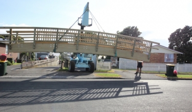 Bridge being craned into place | Local Builders