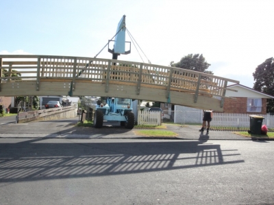 Bridge being craned into place | Local Builders